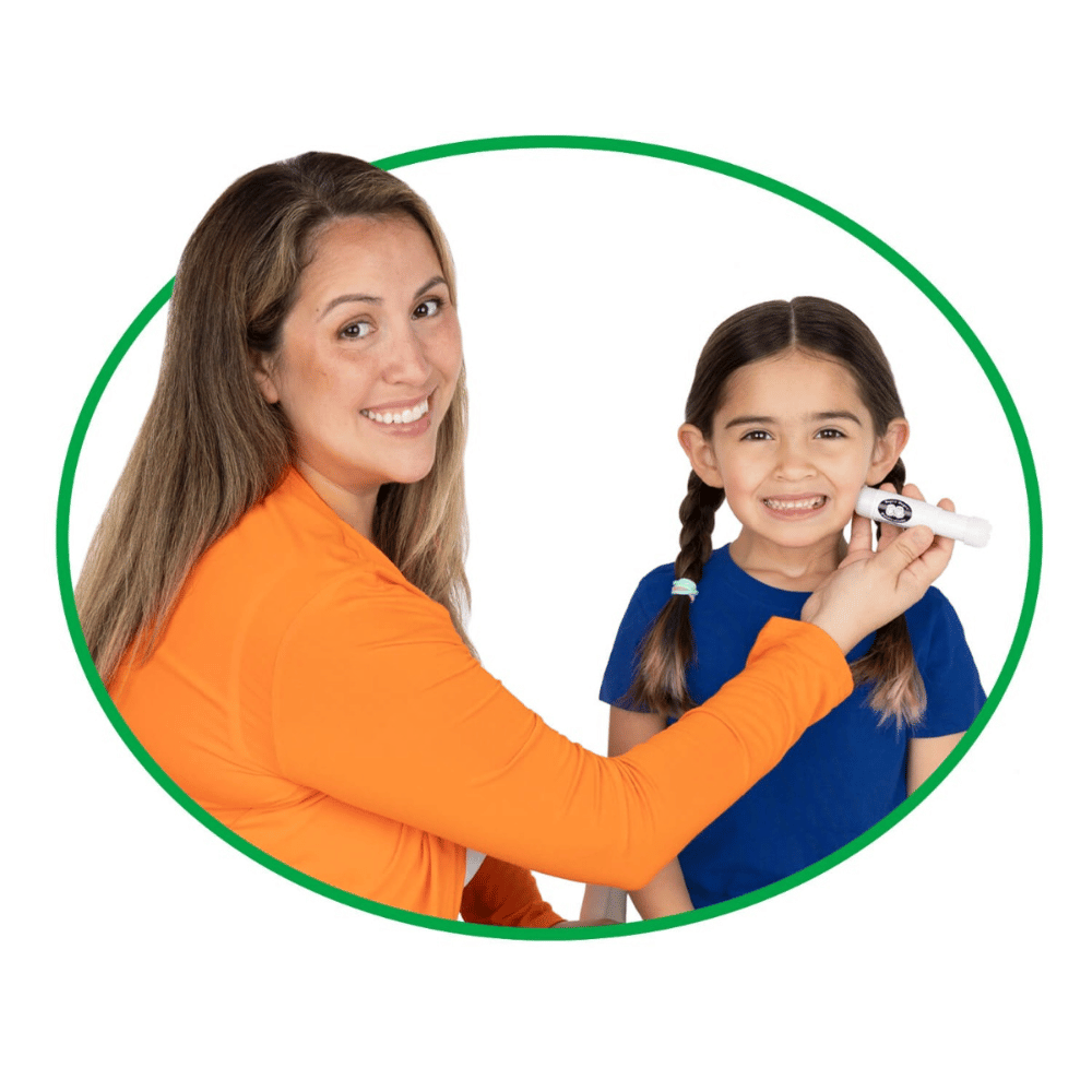 A female Speech-Language Pathologist with dark hair (SLP) using the Mini-Textured Massager with her young female patient