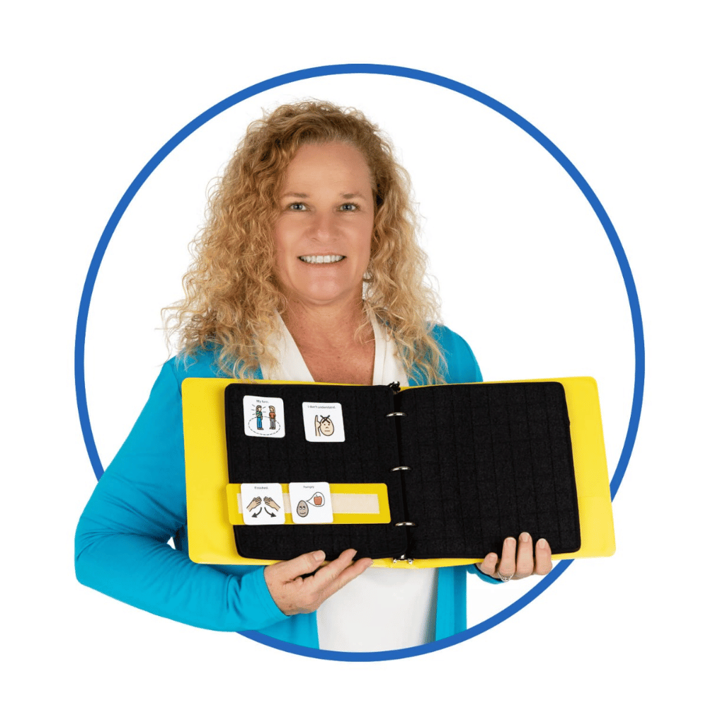 A Speech-Language Pathologist (SLP) holding the Webber® Large Communication Book