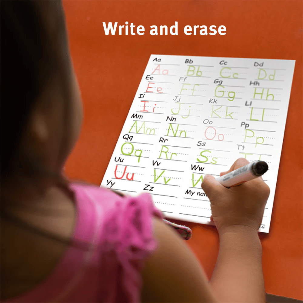 Photo of a young girl use the Alphamat to practice writing the letters of the alphabet