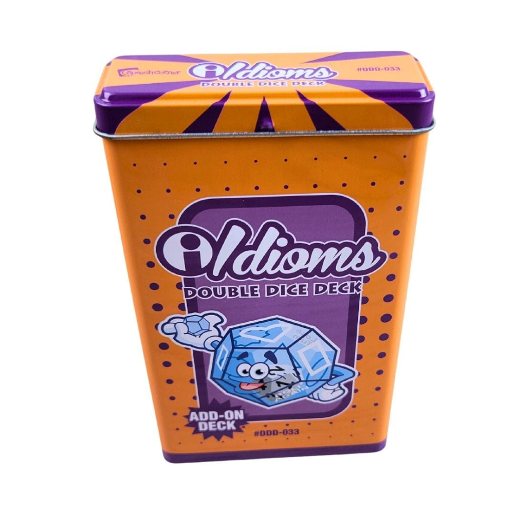 A metal tin of Idioms Double Dice Deck Add-On, featuring an orange body with purple accents, a cartoon ice cube character, and the Oldioms logo on a white background.