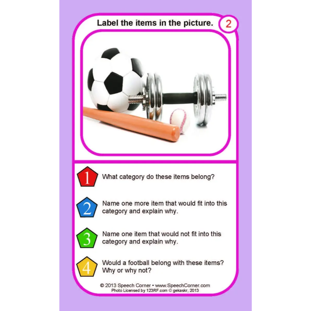 A purple educational card with a pink border, featuring a photo of a soccer ball, dumbbell, and wooden bat, with printed activity questions below.