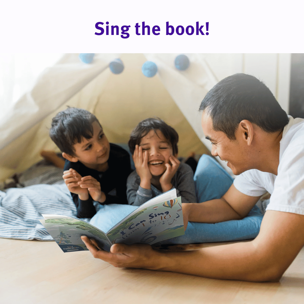 Father with brown hair reading I Can Sing from 1 to 10 to his two young boys