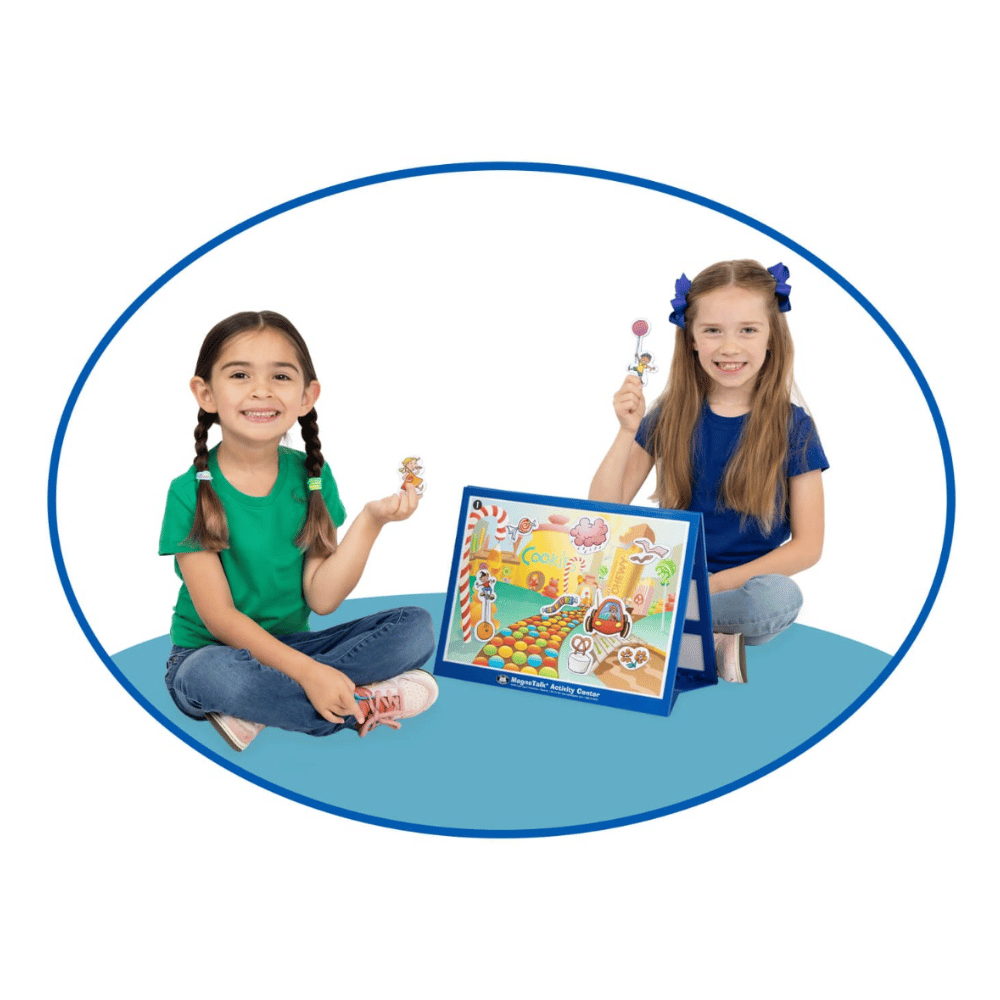 Two young female students using the MagneTalk® Match-up Fantasy Story Adventures game board at school