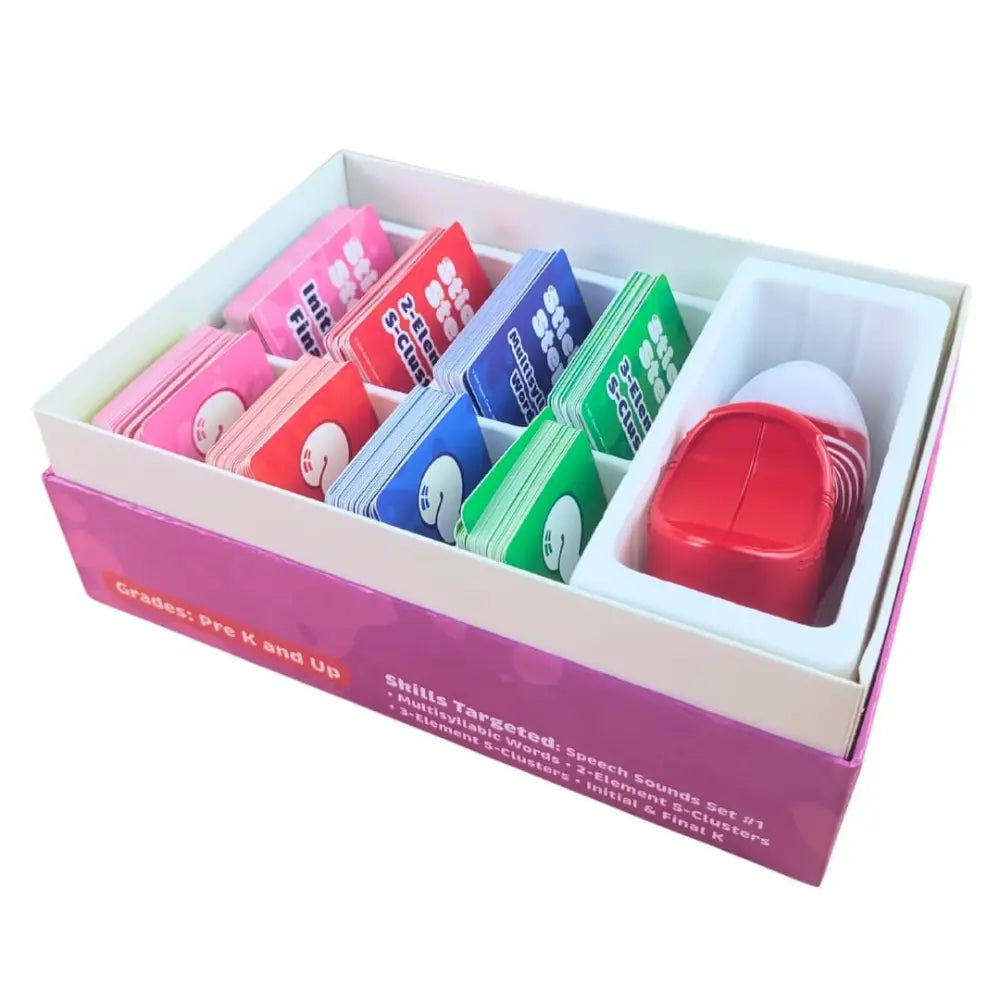 A boxed educational sound card set shown open on a white background. The set includes multiple colorful card decks in pink, red, blue, green, and white, plus a red and white plastic sound effect container in a white tray.
