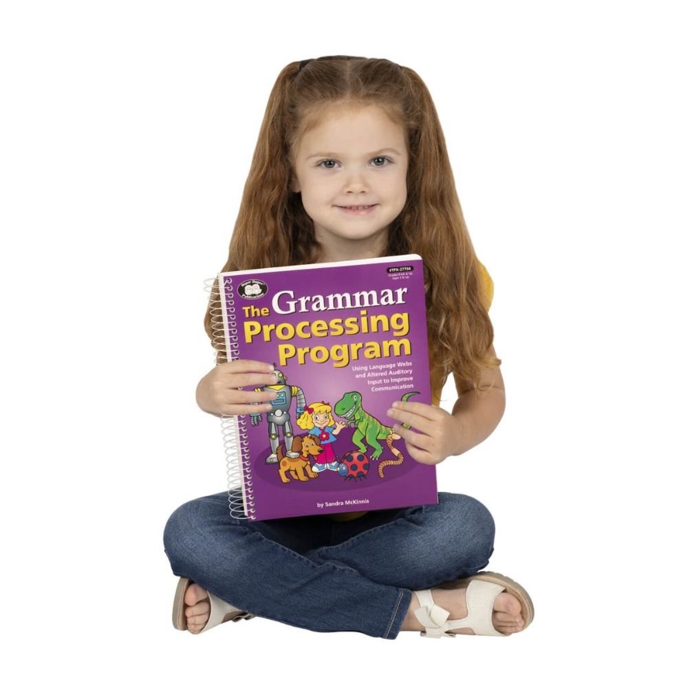 Child holding a book titled 'The Grammar Processing Program' on a white background
