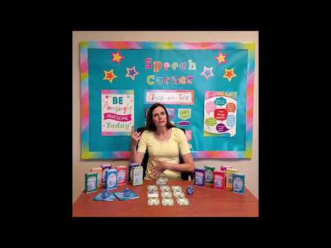 Author Rachele Ellsworth sitting at a wooden desk explaining how to use the Compare & Contrast Double Dice Add-On Deck photo cards.