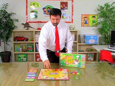 A Speech-Language Pathologist (SLP) demonstrating how to use Go for the Dough® Board Game 