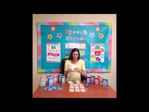Author Rachele Ellsworth (female with dark hair wearing a yellow shirt) sitting at a wooden desk explaining how to use the Inferences Double Dice Add-On Deck
